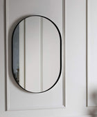 Black Oval Metal Wall Mirror - The Farthing