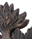 Decorative metal design with leaf-like patterns on a white background