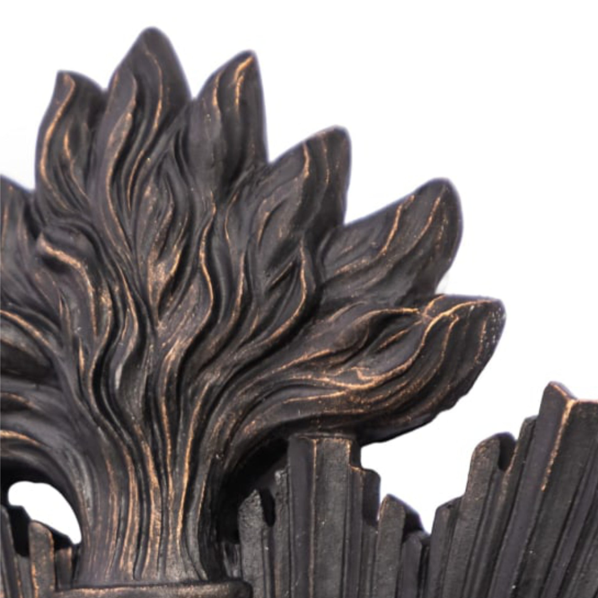 Decorative metal design with leaf-like patterns on a white background