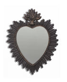 Heart-shaped mirror with decorative frame on a white background