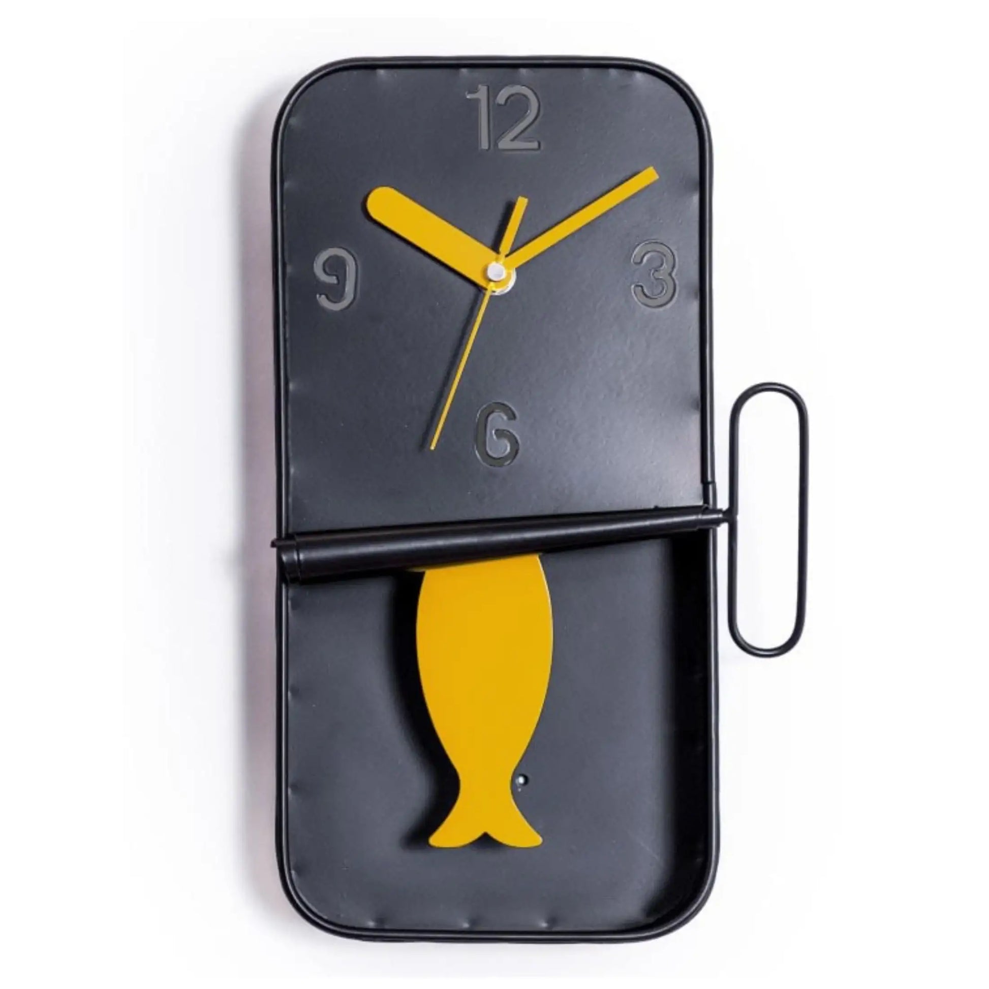 Black wall clock with yellow fish design and clock hands on a white background
