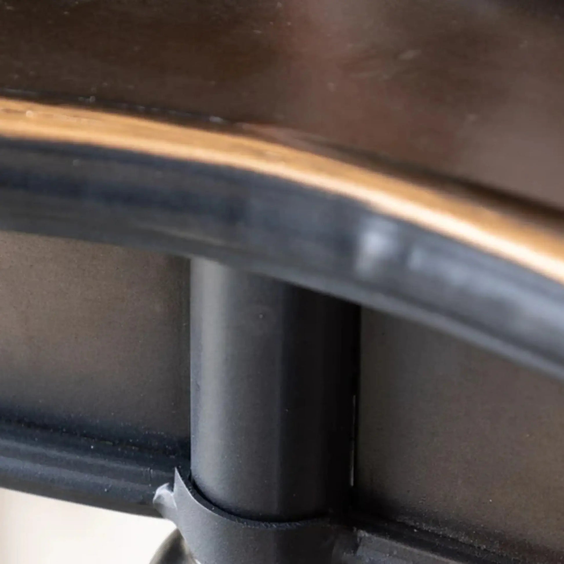 Close-up of a wheelchair's armrest and seat