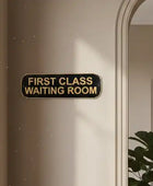 Door with a sign reading 'First Class Waiting Room' on a neutral background