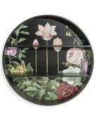 Round decorative shelf with floral designs on a black background