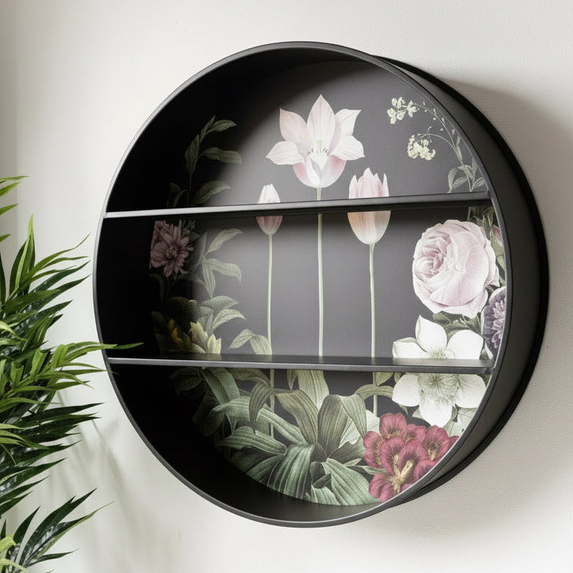 Round decorative shelf with floral design on a white wall