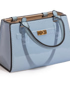 Light blue handbag with a gold clasp on a white background