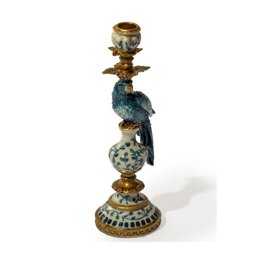 Decorative candle holder with bird design on a white background