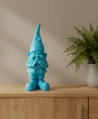 Blue gnome figurine on a white background