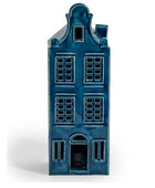 A glossy blue ceramic Dutch house figurine with detailed window patterns and a gabled roof, set against a plain white background.