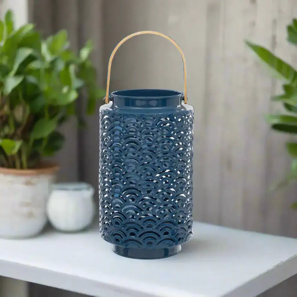 Blue decorative lantern with a gold handle on a white background