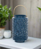 Blue decorative lantern with a gold handle on a white background
