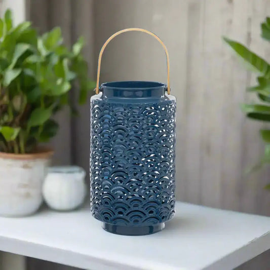 Blue decorative lantern with a gold handle on a white background