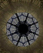 Decorative circular light fixture casting a pattern on a wall