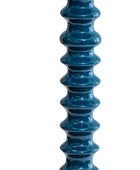 A tall, narrow ribbed vase or decorative column in glossy deep teal-blue, shown upright against a plain white background.