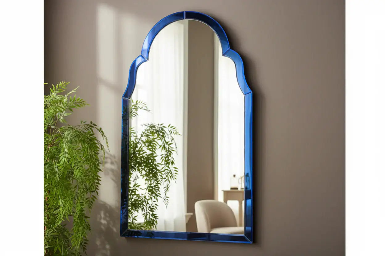 Decorative mirror with blue frame on a wooden surface