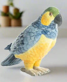 Parrot-shaped cookie jar with blue and yellow colors on a white background