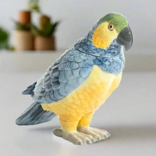 Parrot-shaped cookie jar with blue and yellow colors on a white background