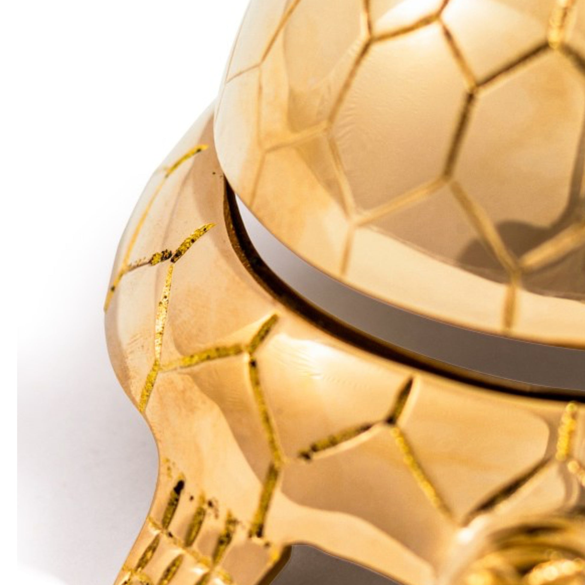Close-up of a gold textured object on a white background