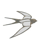 Decorative metal swallow sculpture on a white background