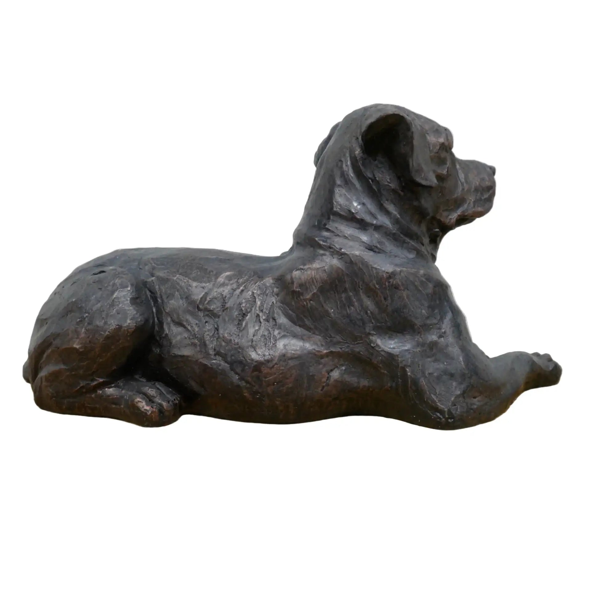 Bronze sculpture of a lying dog on a wooden base with a white background