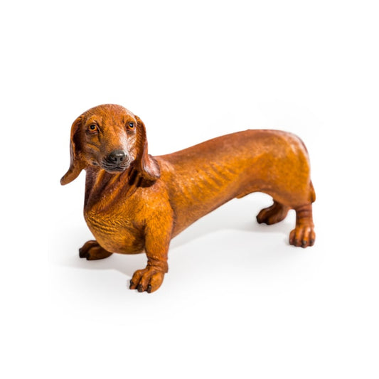 Brown dachshund figurine on a white background