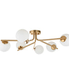 Modern ceiling light fixture with gold frame and white glass shades on a white background