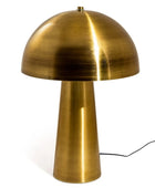 Brass table lamp with a dome-shaped shade on a white background