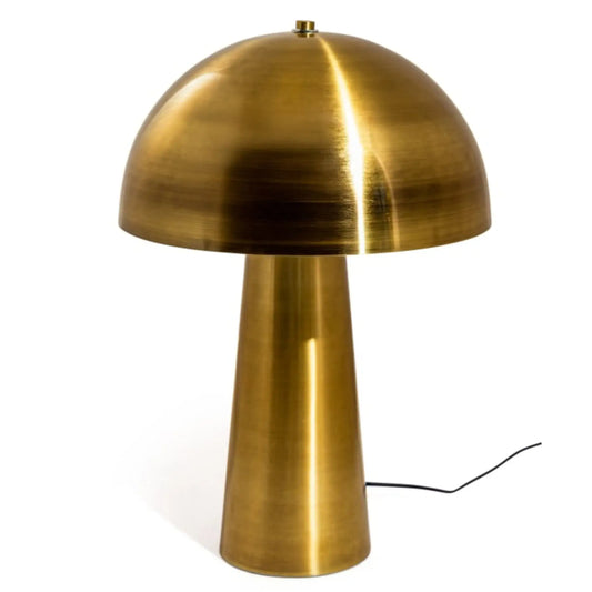 Brass table lamp with a dome-shaped shade on a white background