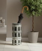 Umbrella stand with a tree and umbrella inside in a room setting