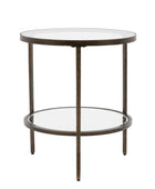 Round side table with glass top and bronze metal frame on a white background