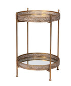 Decorative metal side table with intricate designs on a white background