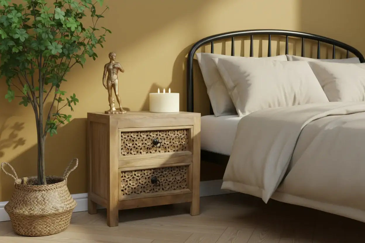 Bedroom with wooden nightstand, bed with white bedding, and decorative items.