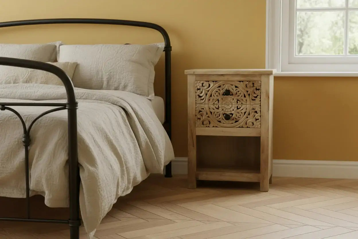Bedroom with a bed and wooden nightstand against a yellow wall.