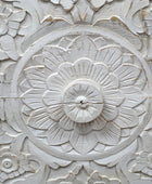 Close-up of decorative stone wall with floral patterns