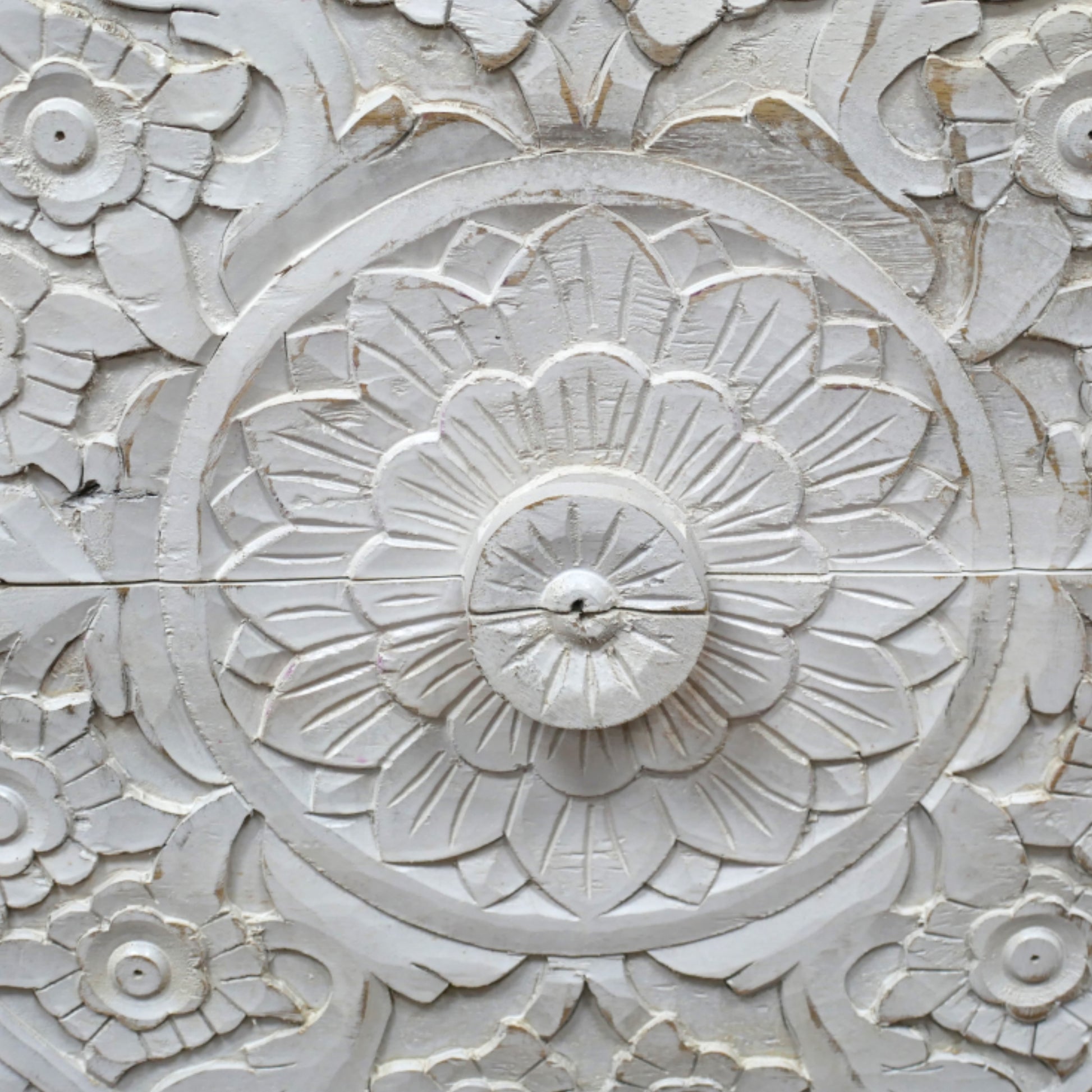 Close-up of decorative stone wall with floral patterns