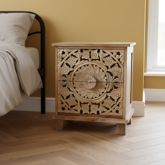 Wooden nightstand with intricate carvings in a bedroom setting
