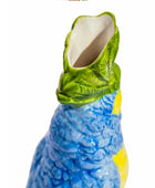 Ceramic parrot-shaped vase with green head and blue body on a white background