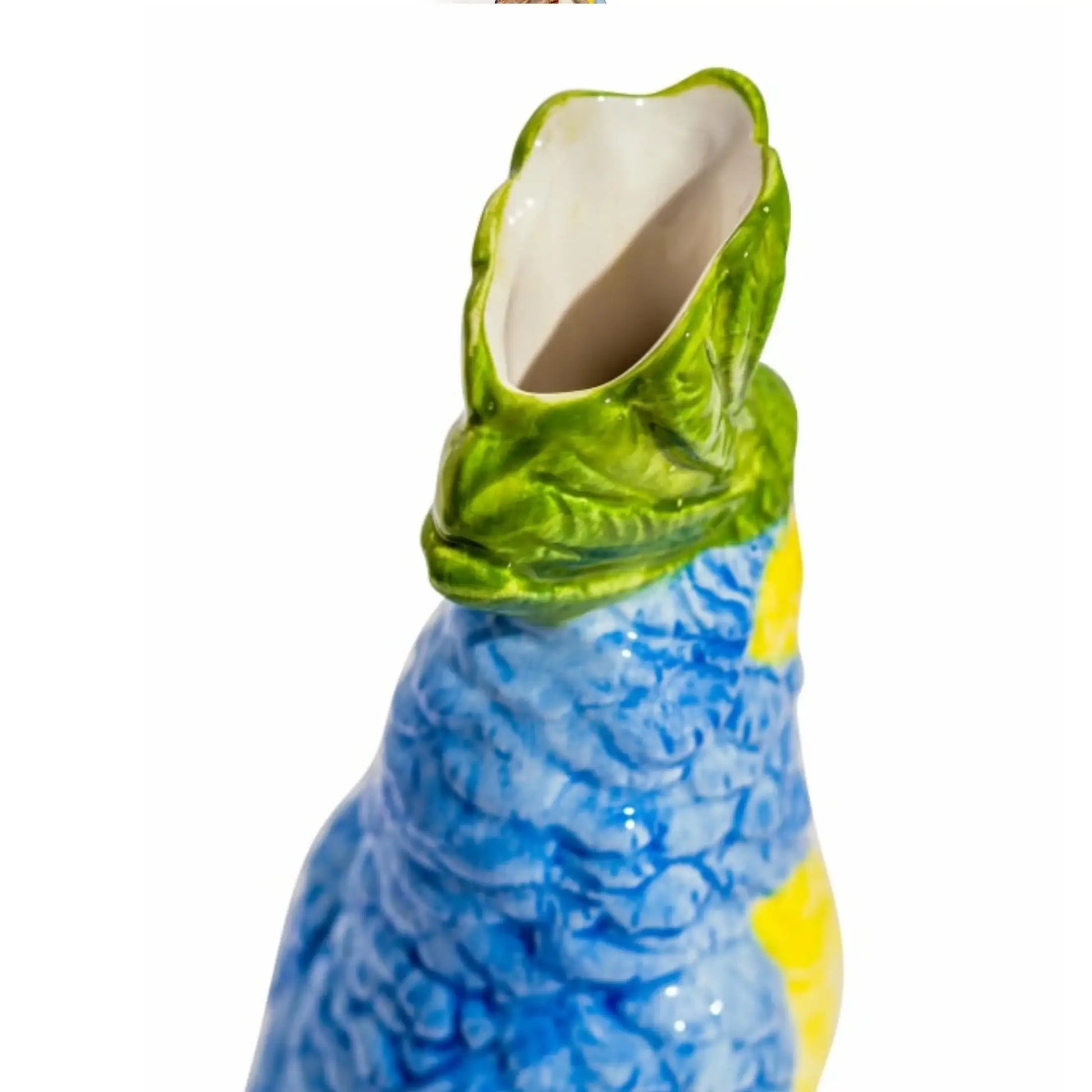 Ceramic parrot-shaped vase with green head and blue body on a white background