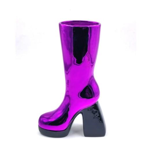 Shiny purple boot on a white background