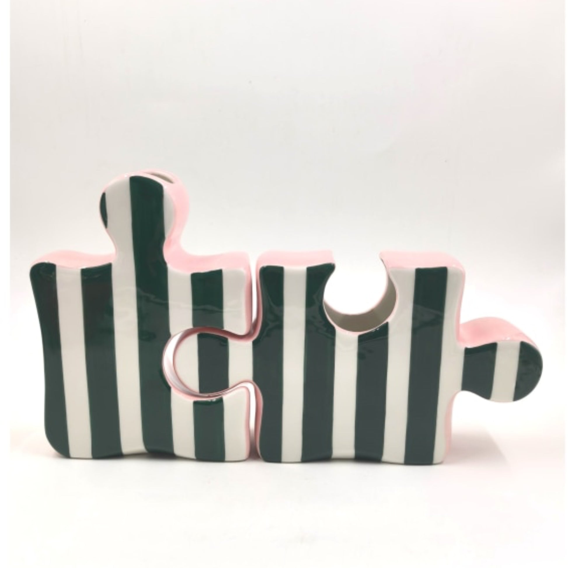 Three striped puzzle pieces on a white background