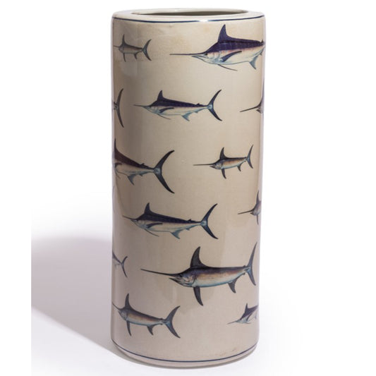 A tall cylindrical ceramic vase with a glossy finish, decorated with a repeating pattern of sailfish in dark blue-gray and silver-gray tones on a warm beige background.