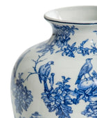 White ceramic vase with blue floral and bird patterns on a white background