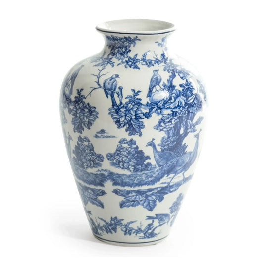 Blue and white ceramic vase with floral and bird pattern on a white background