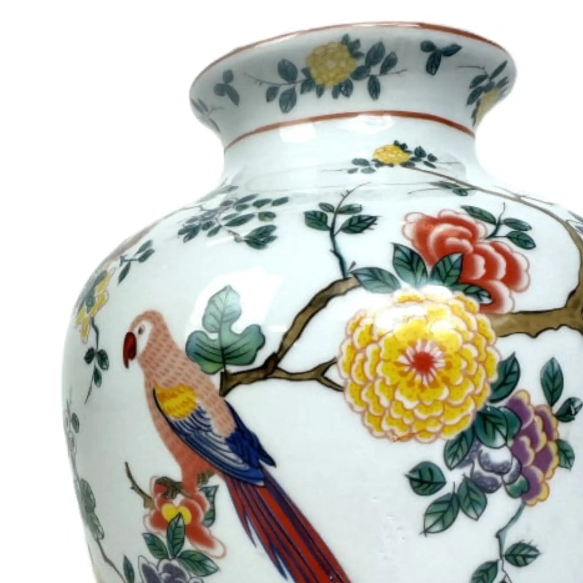 Decorative vase with floral and parrot design on a white background