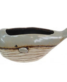 A ceramic whale-shaped planter with a glossy light gray-blue upper body, a textured cream lower body with brown horizontal lines, and a dark interior, shown on a plain white background.