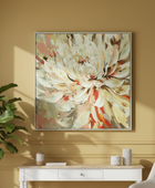 Framed floral artwork on a yellow wall above a white console table with decorative items.