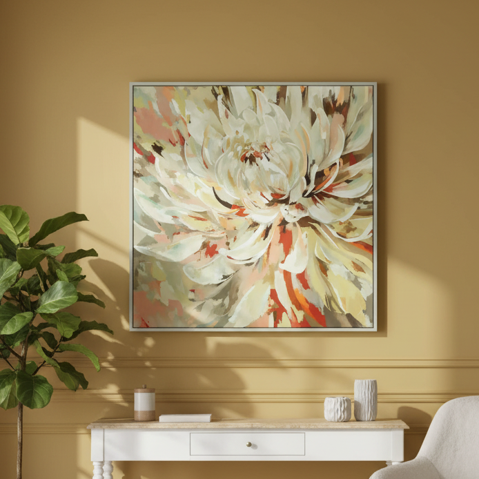 Framed floral artwork on a yellow wall above a white console table with decorative items.