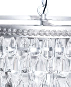 Close-up of a chandelier with crystal-like design on a white background