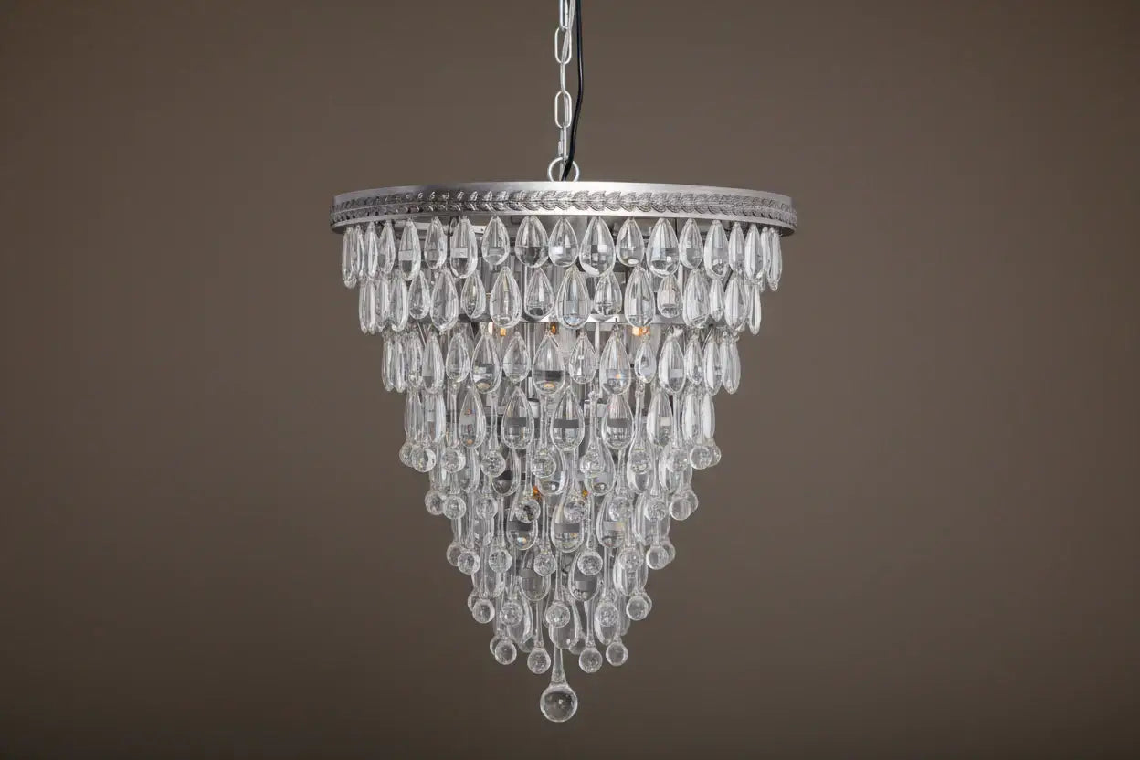 Crystal chandelier hanging against a brown background