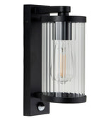 Black outdoor wall light fixture with clear glass shade on a white background